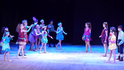 DNIPROPETROVSK, UKRAINE - FEBRUARY 23, 2016: Unidentified children, ages 4-13 years old, perform Once in the city… at the State Palace of children and youth.