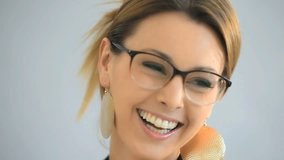 Closeup of cheerful businesswoman with eyeglasses