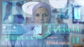 Nurse using Futuristic Analytical Interface in Operating Room. Shot on RED Cinema Camera. - Powered by Shutterstock - Get 15% off with code: PIKWIZARD15