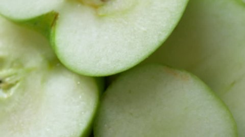 Macro shot of a green apple fruit spinning 스톡 비디오
