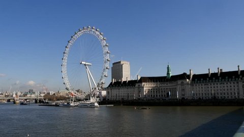 LONDON, UK - 24 JANUARY 2016: 4K Timelapse footage of London Eye and Country Hall in London, United Kingdom