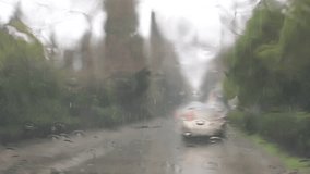 Bad weather and rain drops  on the windshield