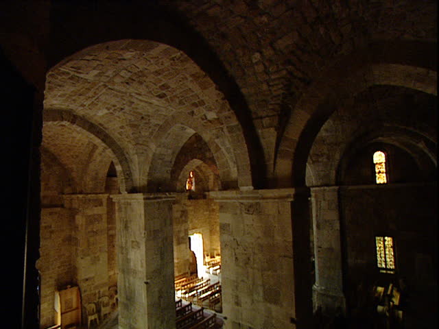 Byblos, Lebanon - 2004 - Wide tilt down from above the apse and nave of the 900 year old Friary of Saint John-Mark. The great medieval columns bisecting the nave are dominant in the frame. | Shutterstock HD Video #14806870
