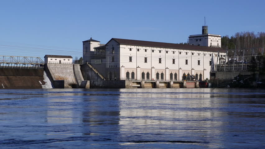 Hydro electric power station streaming river in front