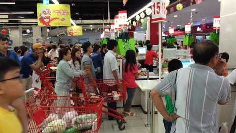 VUNG TAU, VIETNAM - FEBRUARY 6, 2016: Unidentified tourists choose goods at a souvenir shop at the Lotte Mart supermarket. The city is a popular sea resort. 