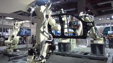 SHANGHAI, CHINA - 7 NOVEMBER 2015: Japanese car maker has an automated production line on display at a robotics and technology exhibition in Shanghai, China