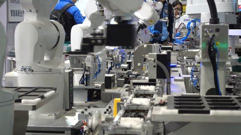 SHANGHAI, CHINA - 7 NOVEMBER 2015: Assembly line robots on display at a robotics and technology fair in Shanghai, China