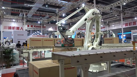 SHANGHAI, CHINA - 7 NOVEMBER 2015: A robot lifting boxes is on display at a robotics and technology exhibition in Shanghai, China