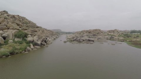 4K / HD Aerial Footage . India, Hampi. Originally shot in 4K on GoPro Hero 4 Black with Protune mode on in 3840x2160 25p. River in Hampi. Shooting Air.