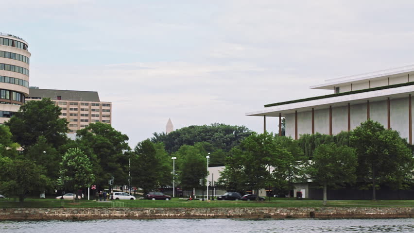 Smooth tracking shot of WASHINGTON, DC : Summer on scenic Potomac River, Kennedy Center, Washington DC Georgetown 