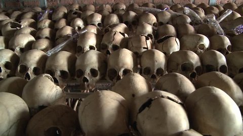 Thousands of skulls in long rows remember the genocide in Rwanda.