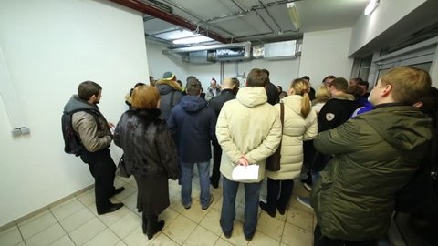 MOSCOW - DEC 11, 2014: People on meeting of homeowners of Elk Island residential complex with management company DS Exploitation