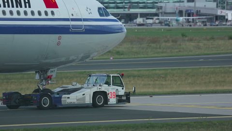 FRANKFURT AM MAIN, GERMANY - SEPTEMBER 4, 2015: Air China Airbus 330-300 B-5947 towing from service area. Unofficial spotting in Fraport on Sep. 4, 2015
