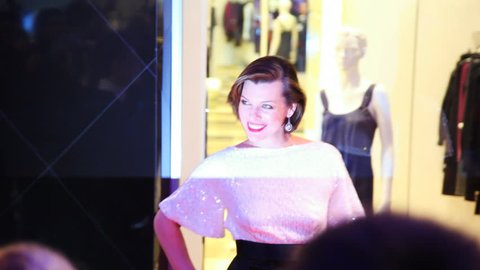 MOSCOW, RUSSIA - FEBRUARY 13: Milla Jovovich poses for photographers and journalists in shopping mall Vegas on February 13, 2011 in Moscow, Russia. Jovovich signed a star with her name on Moscow's Walk of Fame that same night.  Editorial Stock Video