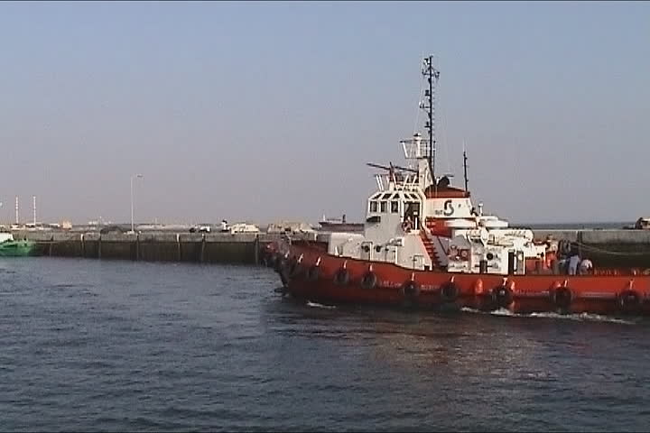 Tugboat arriving in port