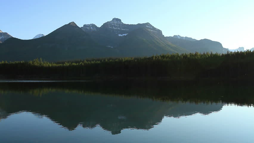 Alpine lake with reflection pan
