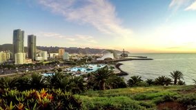 Panoramic view on Santa Cruz city the capital of Tenerife island. Time lapse video footage with sunrise