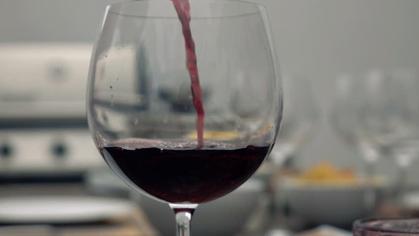 Red wine pouring to the glass
 | Shutterstock HD Video #14871655