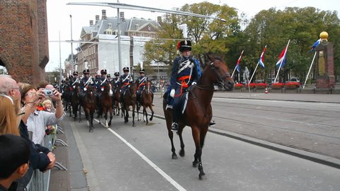 THE HAGUE, HOLLAND - SEPTEMBER 19: Cavalry draws their swords in the Prinsjesdag parade on September 19, 2011 in The Hague, Holland. Prinsjesdag is the opening of Parliamentary year in Holland.