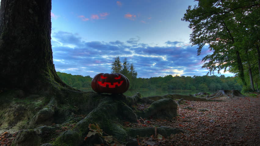 Halloween pumpkin and trees in sunset, HD motion controlled time lapse, high