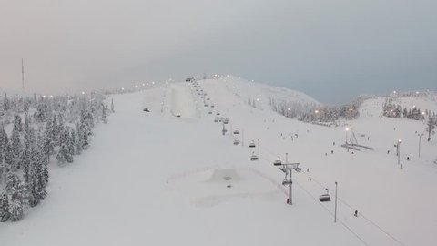 Aerial long shot of ski slope and ski lift(chair lift). Winter. Finland.