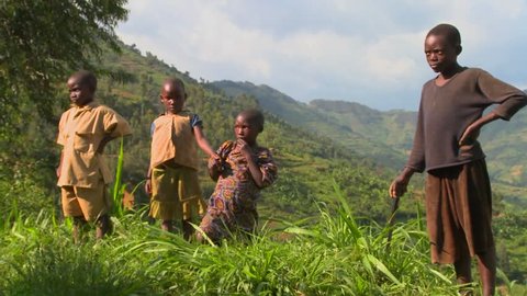 RWANDA - CIRCA 2009: Rwanda children stand in farm fields circa 2009 in Rwanda.