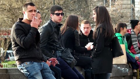 Sofia, Bulgaria - 28 February 2016: group of Young people smoke in park in Sofia, 28 February 2016