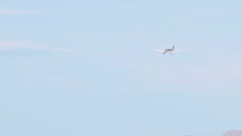 Private plane descending and making it's way toward the runway to land.