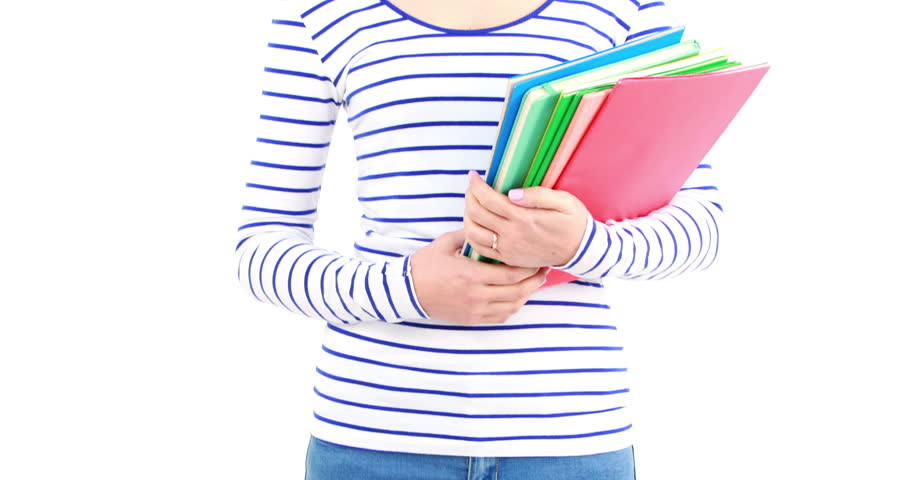 Portrait of pretty Asian woman holding books and smiling at the camera on white screen