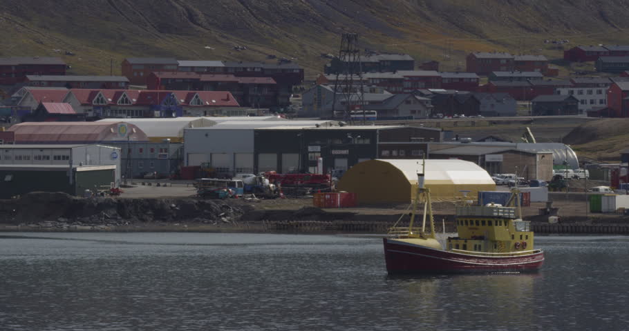 A tourist boat rests in the arctic harbor of longyearbyen on a sunny day. - A002 C023 0708Z6 001