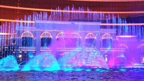 MACAU, CHINA – SEPTEMBER 10, 2013: View to the facade of the Wynn hotel with dancing fountains in Macau, China.