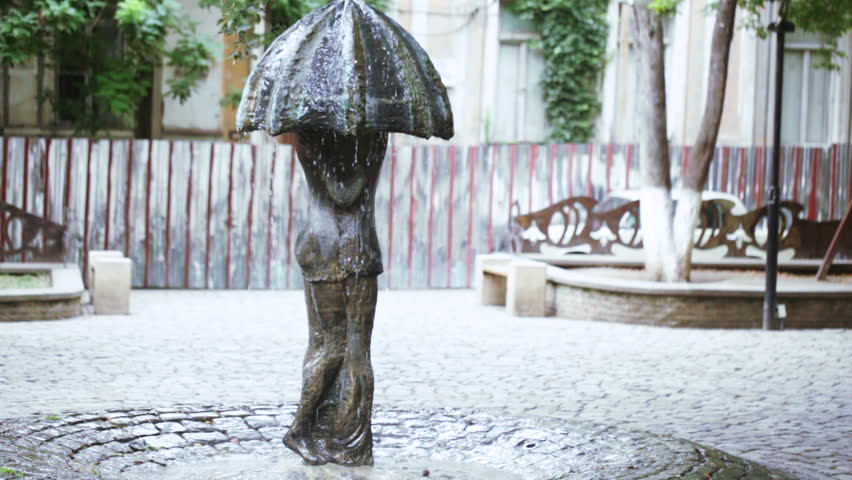 Monument in form of an umbrella and loving couple