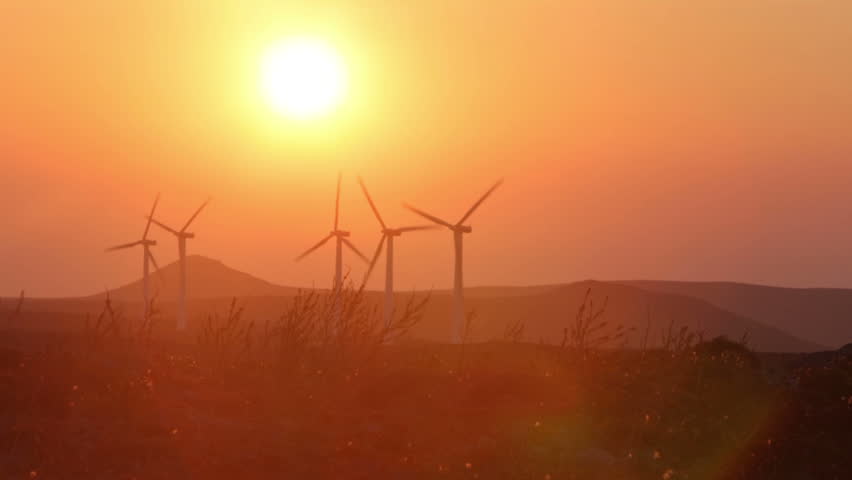 Many windmills in front of beautiful landscape and sun | Shutterstock HD Video #14925607