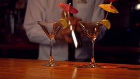 Bartender pouring cocktails on counter in high quality 4k format - Powered by Shutterstock - Get 15% off with code: PIKWIZARD15
