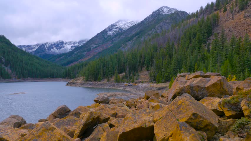 Large rocks on the shore of the lake high in the mountains. Central Cascades. Washington state. Landscape video. 4K, 3840*2160, high bit rate, UHD