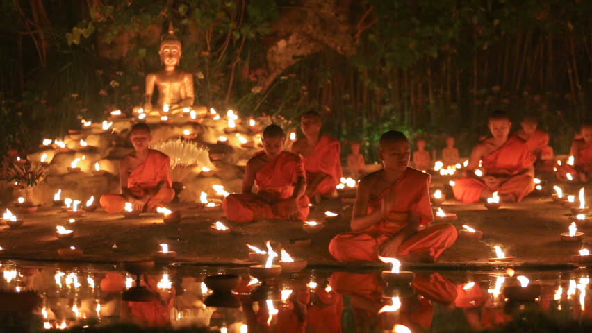 CHIANG MAI THAILAND - FEBRUARY 22 : Magha puja day is the important incidents Buddhist day. Buddhist monks light the candle for buddha . Feb 22, 2016 in Phan Tao Temple, Chiangmai, Thailand. Royalty-Free Stock Footage #14934463