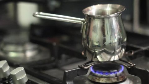 Turkish Coffee Pot With Boiling Coffee On An Old Electric Stove. Stock  Photo, Picture and Royalty Free Image. Image 38066992.