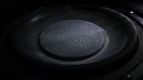 Bass loud speaker throws dust in the air. Super slow motion. Equalizer concept
