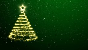 Golden lights spiraling upwards to form an abstract Christmas tree with a star treetopper. Green background with snowflakes falling down on the ground. The camera rotates around the tree. - Powered by Shutterstock - Get 15% off with code: PIKWIZARD15