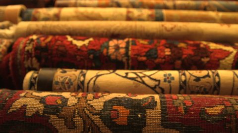Kuwait Souk. Close up rack focus between colorful hand made rugs and carpets in Souk Al Moubarakiya.