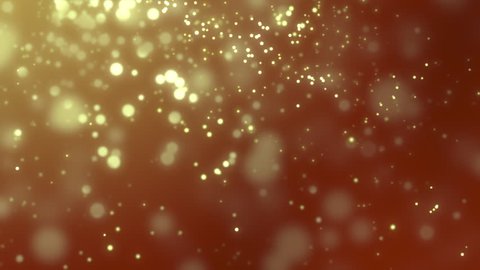 Golden blurred luminous particles falling slowly against red background
