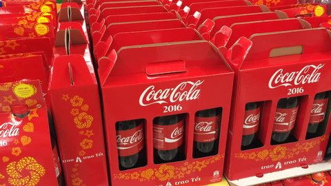 VUNG TAU, VIETNAM - FEBRUARY 6, 2016: A view at stacked red gift boxes with coca cola bottles at a Lotte Mart supermarket. Tet, Lunar New Year, is the biggest holiday in Vietnam.