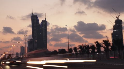 Traffic on a highway during dusk in Bahrain - Time lapse. King Faisal Highway. 