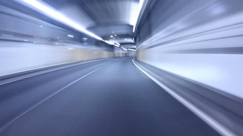 Motion POV timelapse from a car departing central Tokyo through city lights and tunnels.