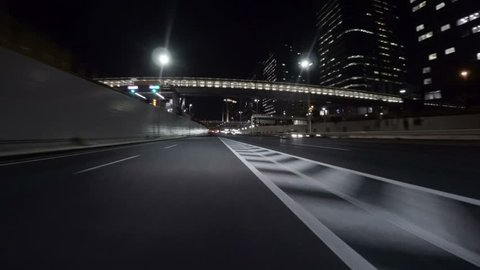 Midnight drive through the empty Tokyo Bayshore Highway through the modern creations over reclaimed lands in Odaiba.