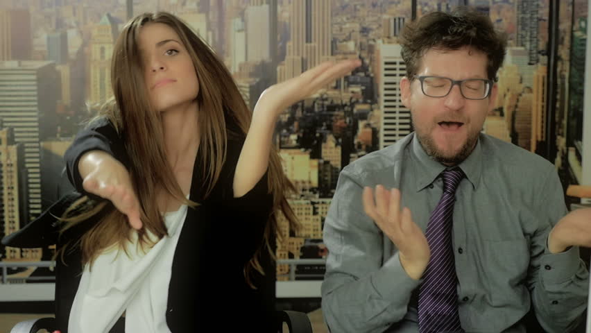 Business people dancing in office after succesful deal slow motion