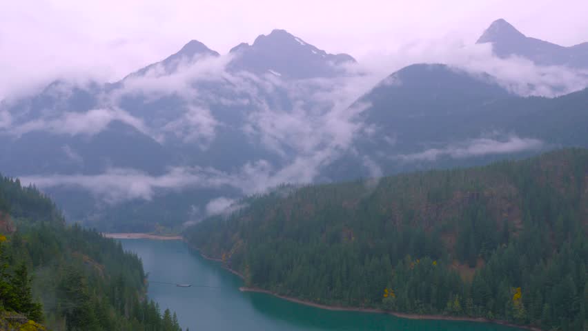 Blue river among the misty mountains. Diablo Lake. Washington state. Landscape video. 4K, 3840*2160, high bit rate, UHD