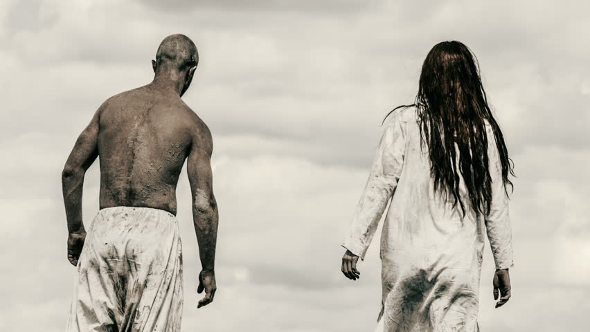 Man and woman walk  on background of sky and clouds. The man in white trousers, the woman in the white raiment.