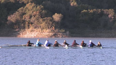 Panning of an eight person rowing sweep on Lake Casitas in Oak View, California.