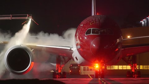 DEICE AT OSLO AIRPORT NORWAY - CA JANUARY 2016: Boeing dreamliner 787 deice 